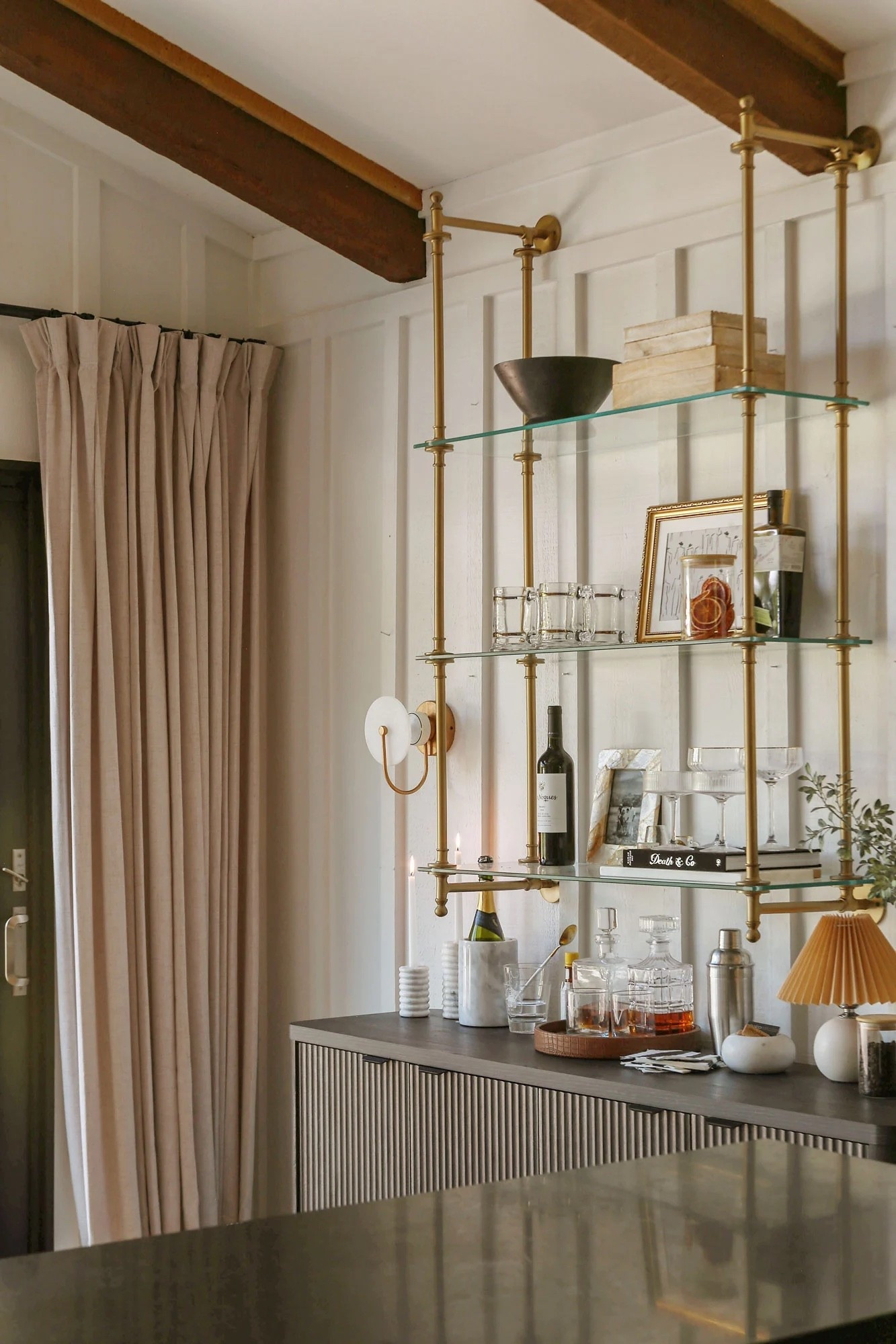 My custom-looking bar without the custom price tag is finally complete! From the brass bistro open shelves to the vintage euro touches, I’m loving this self-serve cocktail zone off of my kitchen . #bar #homebar #bistroshelves #openshelves #kitchen #decor #euro

#LTKHome #LTKSaleAlert