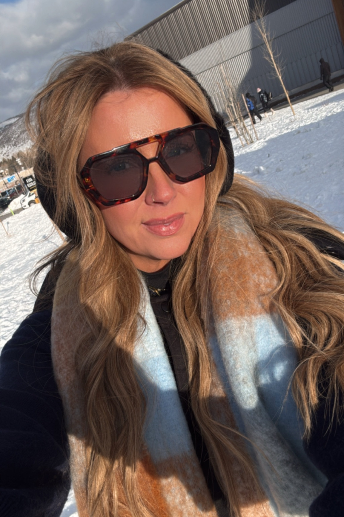 Ugg earmuffs. Amazon scarf and sunglasses  