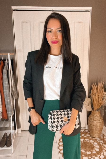 Fun business outfit for fall featuring green slacks, a black blazer, a graphic tee, and a houndstooth crossbody bag.

#LTKworkwear #LTKstyletip #LTKunder50