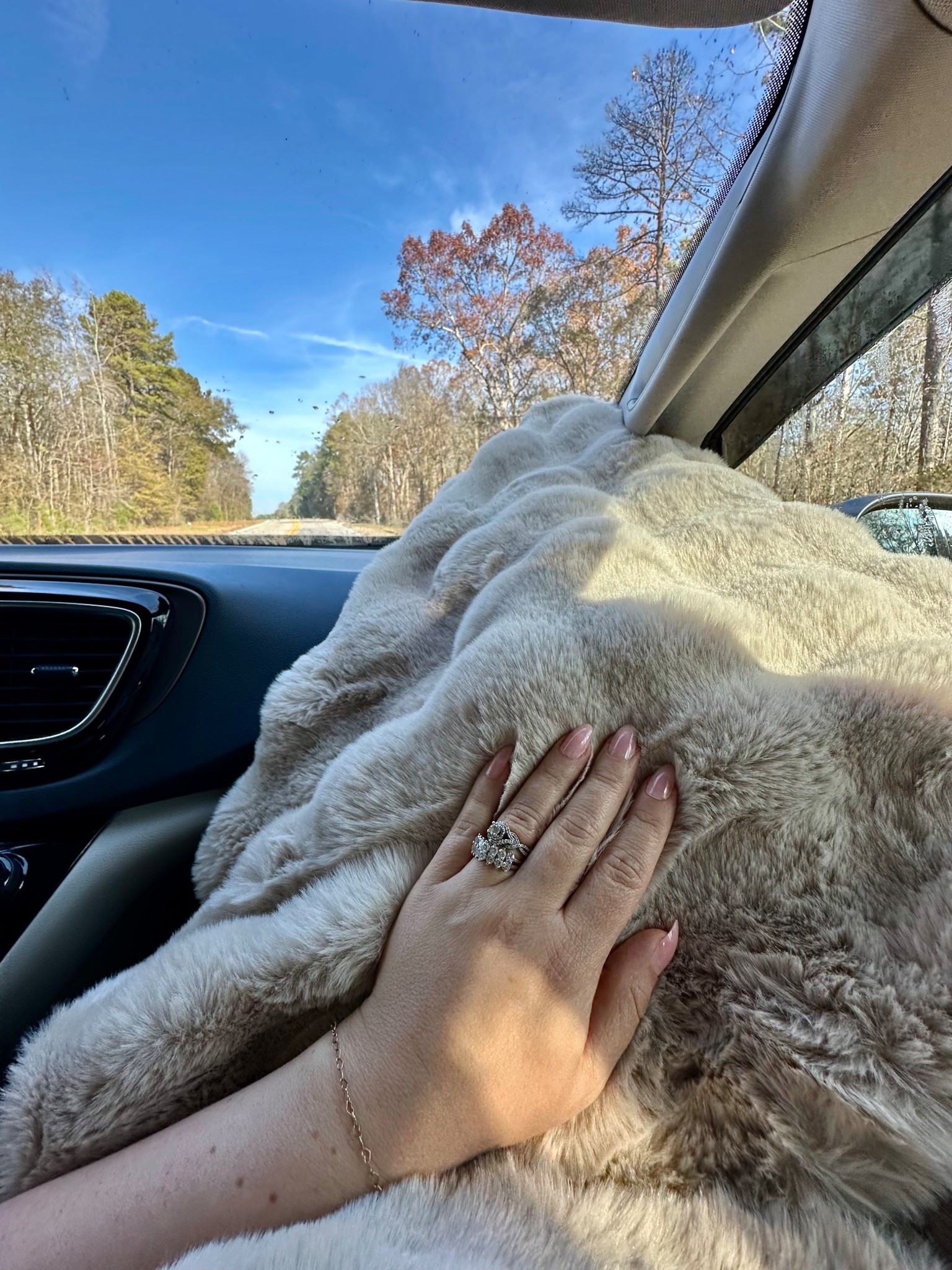 Passenger princess must-haves: faux-fur blanket, cozy travel essentials, and soft neutral nails.

Linking my favorite comfy car finds for winter road trips ↓

#cozytravel #passengerprincess #travelessentials #LTKhome lounge wear, 

#LTKMidsize #LTKmomlife #LTKTravel