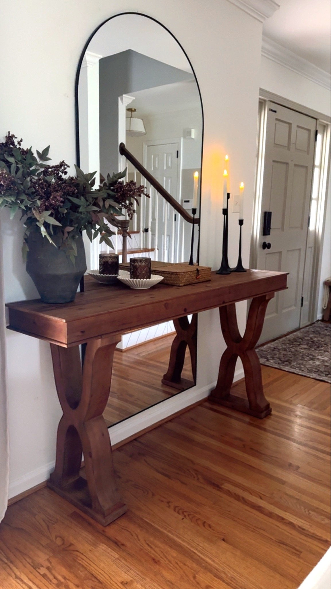 A new table doesn’t mean you need all new decor. 🤎

I finally found a new table for our entryway, and instead of buying everything to style it at once, I shopped our home for pieces I already love.

I started with year-round staples—a favorite vase, taper candles for height and warmth, and a few decorative accents. Then I added just two little nods to early fall: muted mauve berry stems and a cozy scented candle. 🍂

I’d still love to add baskets or storage ottomans underneath, but I’m waiting until I find the right ones rather than buying something just to fill the space.

Because that’s really how I want our home to feel…

Collected over time, not purchased all at once. 🤎

And when the seasons change? I can simply switch out a stem, a candle or a small accent and let those staple pieces stay.

•

•

new entryway table, entryway table styling, console table decor, early fall decor, early fall decorating, transition to fall, subtle fall decor, collected home, collected interiors, shop your home, decorating with what you have, timeless home decor, year round decor, seasonal decorating, mauve berry stems, fall stems, fall scented candle, cottage home decor, vintage cottage style, cozy home, layered interiors, slow decorating, affordable decorating ideas, fall entryway decor

#LTKHome #LTKSeasonal #LTKdayinmylife
