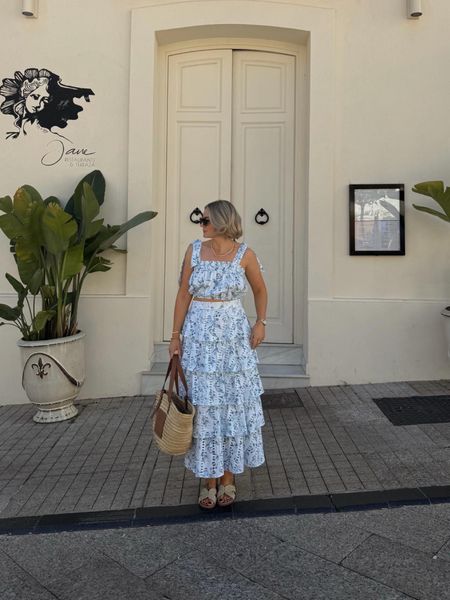 Summer holiday outfit idea - blue & white tired midi skirt & top from Laura Byrnes x Very edit, raffia and tan sandals, loewe basket bag

#LTKstyletip #LTKeurope #LTKSeasonal