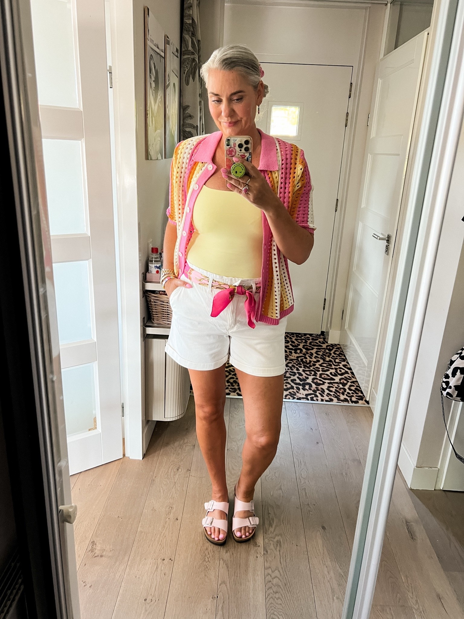 OOTD - Donderdag. Thuiswerken en het is lekker warm. Ik draag een gehaakt poloshirt in roze en geel tinten (Zara, large), daaronder een botergele tanktop, witte twill short (42), een sjaal als riem (oud) en roze Birkenstock slippers.

#LTKnederlands #LTKeurope #LTKsummer