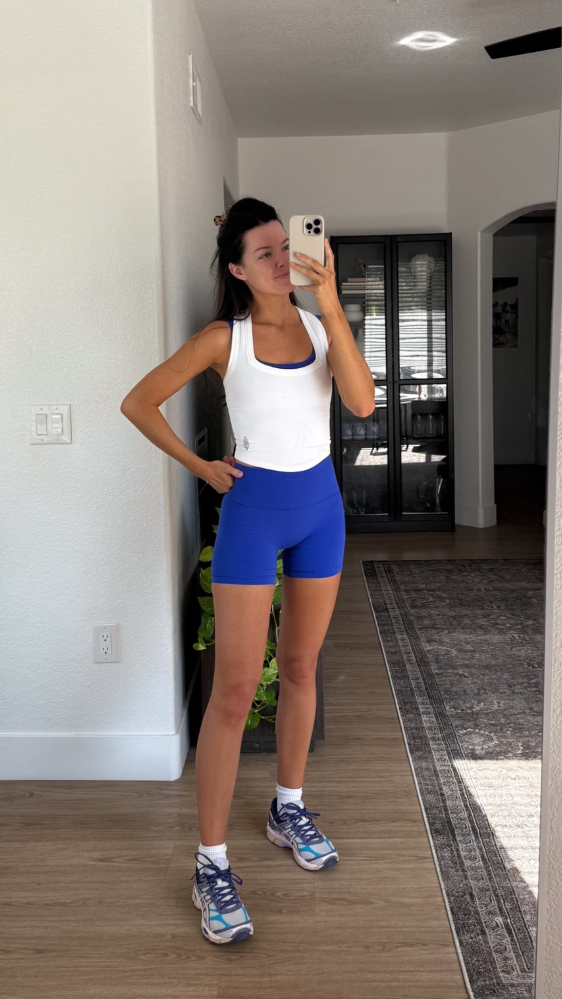 I’m 5’7” wearing small in the shorts, XS in the bra and tank top!