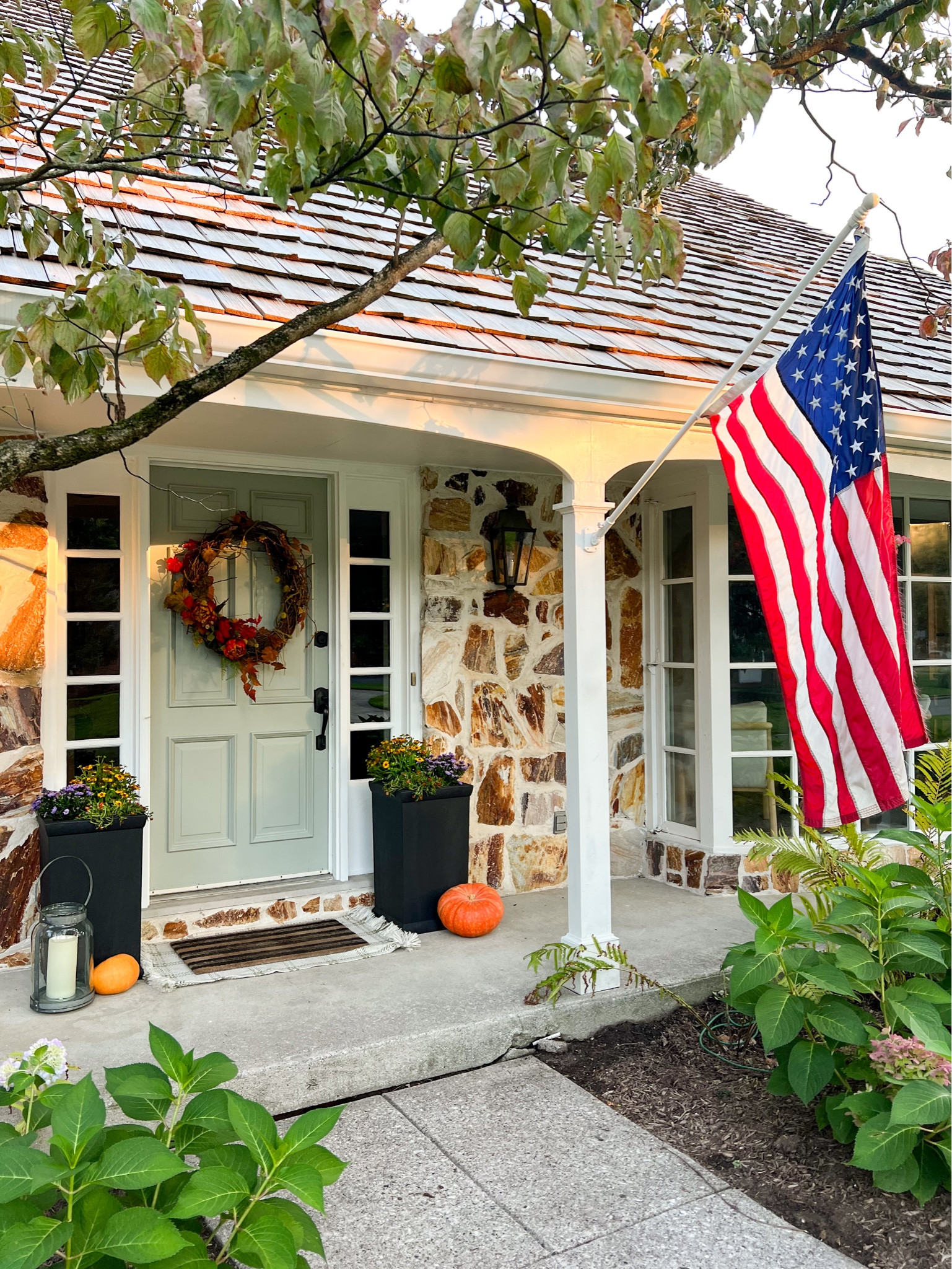 #ad Fall porch makeover. Labor Day weekend savings are here! Head on over to Lowe’s and find everything you need to get your front porch ready for the changing seasons. Add curb appeal with a fresh coat of paint, new planters and an American flag for the holiday weekend. 

#LTKFallSale #LTKSeasonal #LTKHome