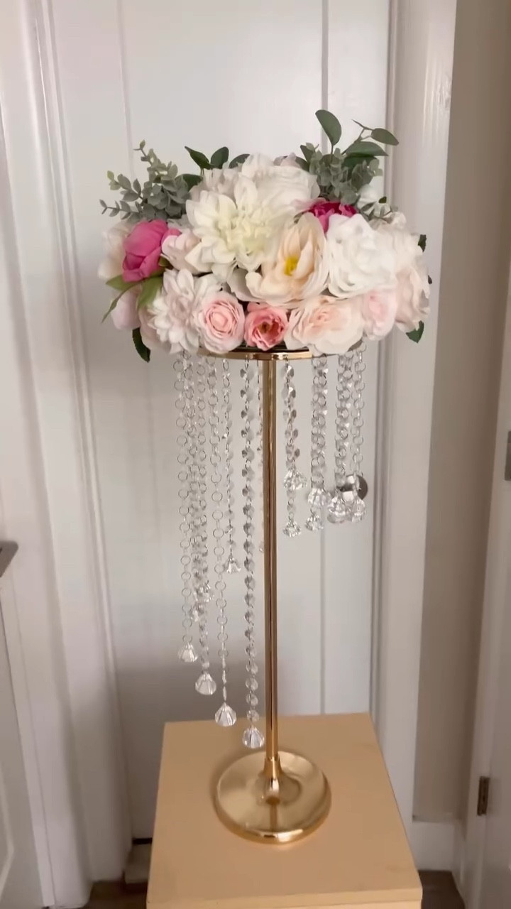 PACKAGE INCLUDES: 2pcs crystal vases for flowers. Each crystal vase measures 27.5”/ 70cm in height and 7.8”/ 20cm in diameter. Flowers are not included.
UNIQUE AND ELEGANT DESIGN: Characterized by modern style adorned with crystal bead pendants, our wedding flower stands contribute to creating a gorgeous and romantic atmosphere in your wedding or reception, which would definitely impress your guests and yourself with pleasant experience.
MULTIPURPOSE: Matching up with fresh seasonal flowers or artificial flowers, the metal flower vases is perfect for wedding table centerpieces, aisle road lead, party decorations. It is also suitable for coffee shop, bar, hotel as well as daily home décor.
EFFORTLESS INSTALL: The wedding flower stand comes with some different segments. It is effortless to assemble even without any instructions.

#LTKfindsunder100 #LTKparties #LTKVideo