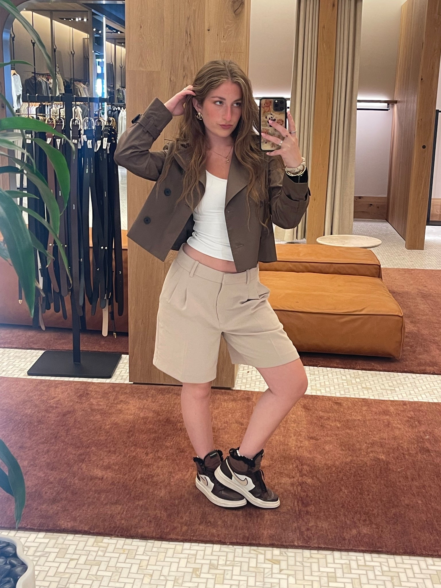 aritzia outfit cropped trench coat with pleated shorts casual fall cool girl style basics jordan shoes 

#LTKStyleTip #LTKShoeCrush #LTKWorkwear