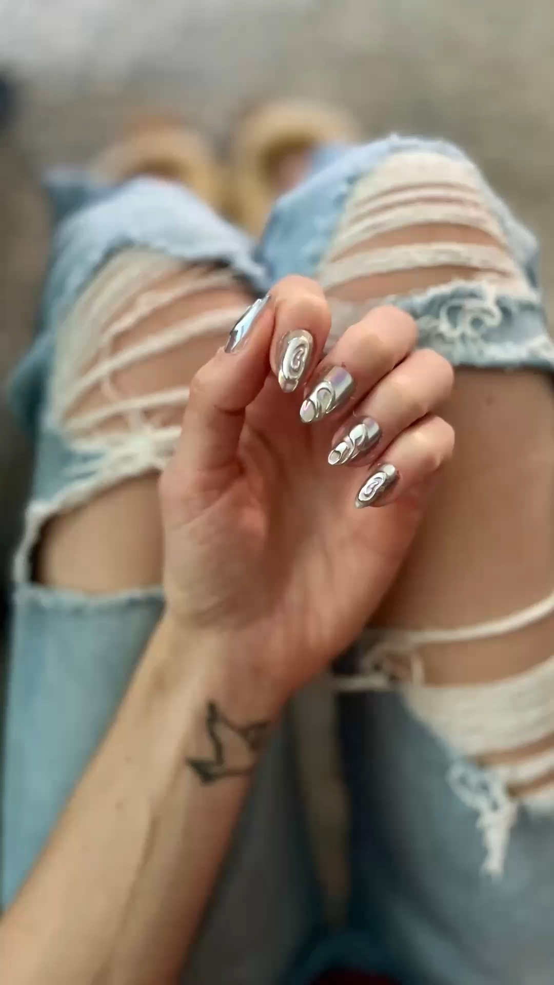 These nails are giving futuristic fairy-core in the best way ✨🩶 

I’m obsessed with the liquid silver chrome + 3D swirl detail. 

They look so high-end and unique, but took me minutes to apply at home. 

The short almond shape is still super wearable for mom life while making it look like I spent hours at a salon. 

Definitely one of my favorite press-on sets lately. 

Linked in my LTK!

#LTKselfcare #LTKBeauty #LTKmomlife