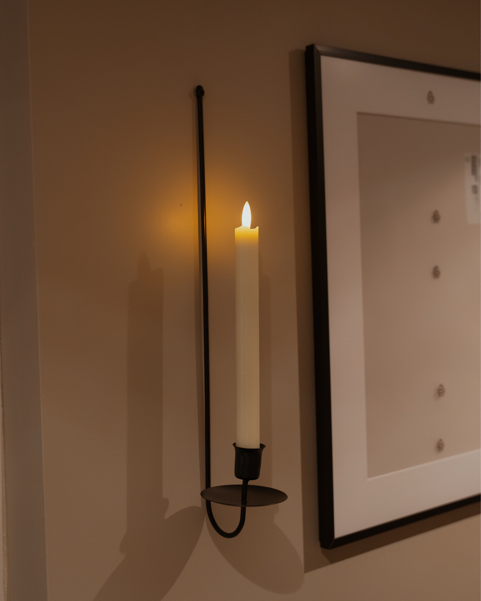 I found the perfect simple wall candle sconces and loved them so much I ended up ordering 2 more! They are so simple but sophisticated. And when paired with these battery powered candles the two together add a romantic luxe look to any hallway or feature wall! If you love a black accent and cozy candle light this is your combo! 

#LTKHome