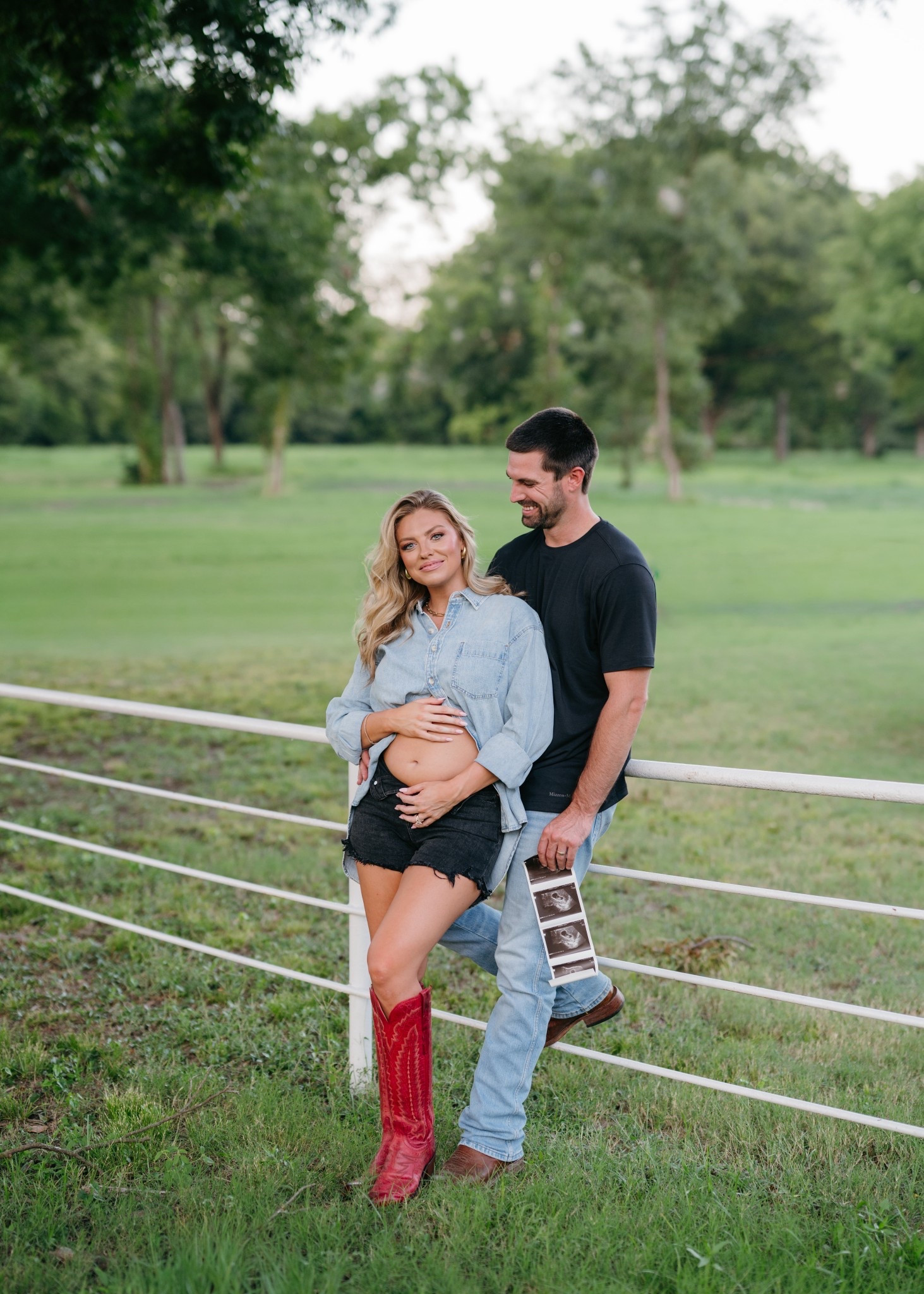 Our pregnancy announcement🤍  We can’t wait to meet our little one! Sharing all my outfit details from our maternity shoot — this denim shirt and red boots are everything! #LTKbump #LTKmaternitystyle #LTKcountry

Shirt-XS (runs big) 
Shorts- 25

#LTKStyleTip #LTKShoeCrush #LTKBump