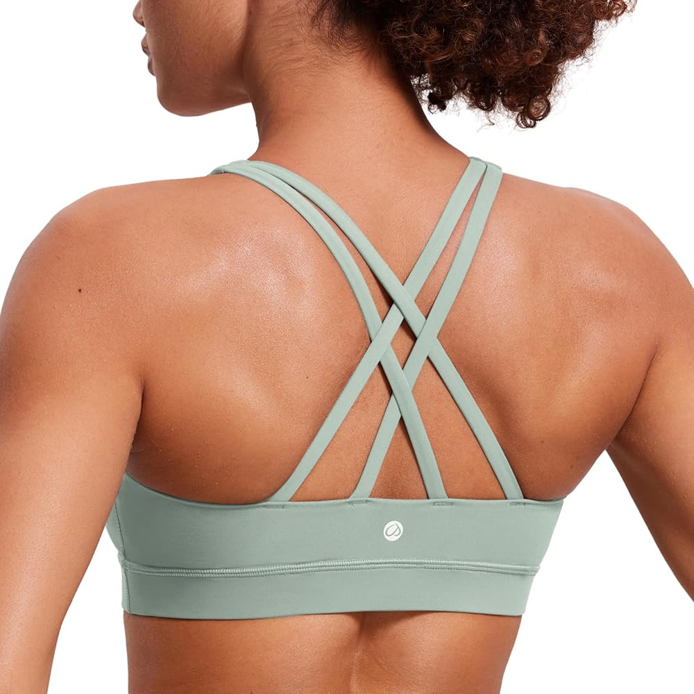 CRZ YOGA Women's Strappy Sports Bras Fitness Workout Padded Yoga Top Criss Cross Back Cami | Amazon (US)