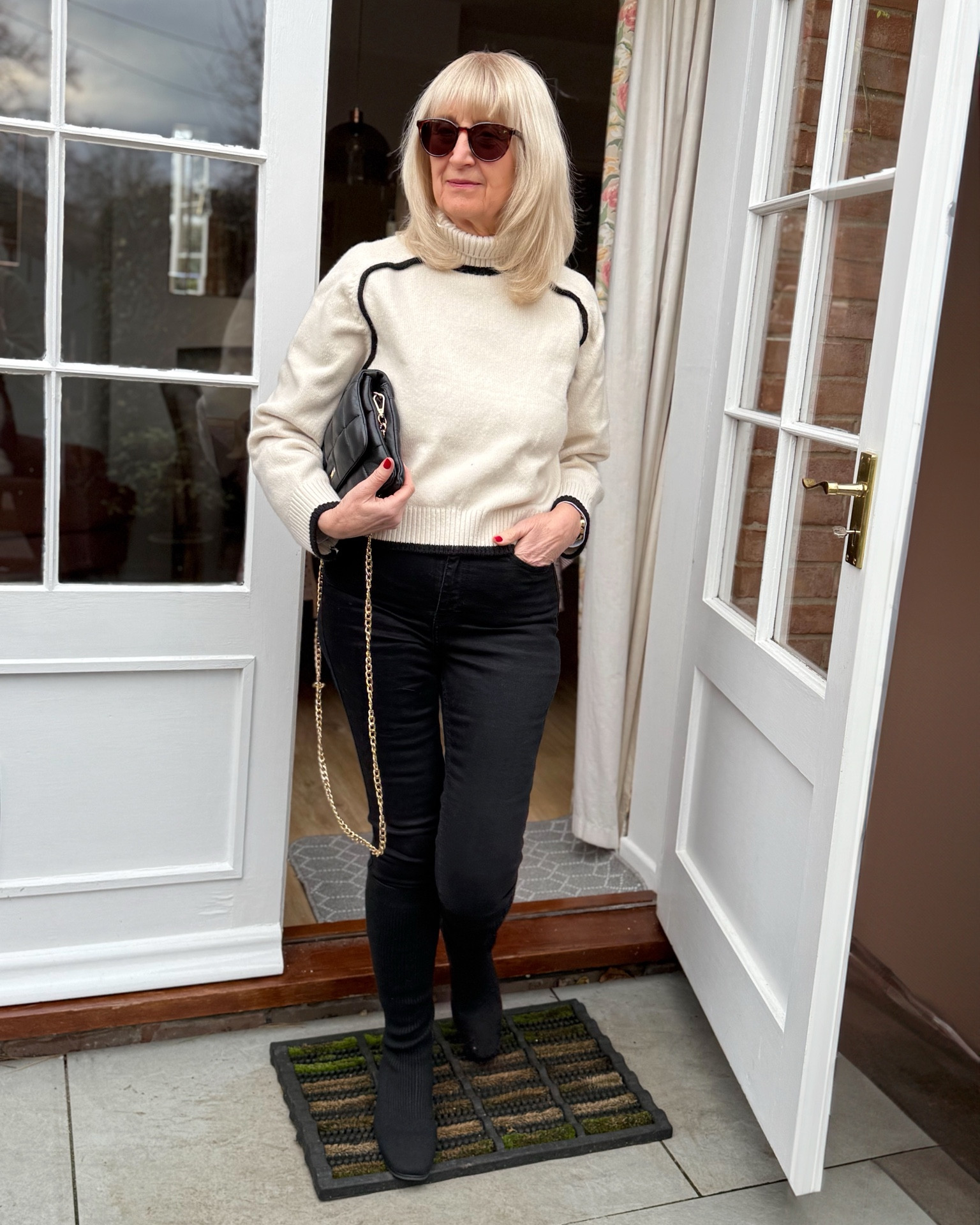 Monochrome jumper with black jeans, boots and accessories 

#LTKuk #LTKFashionMonth #LTKeurope