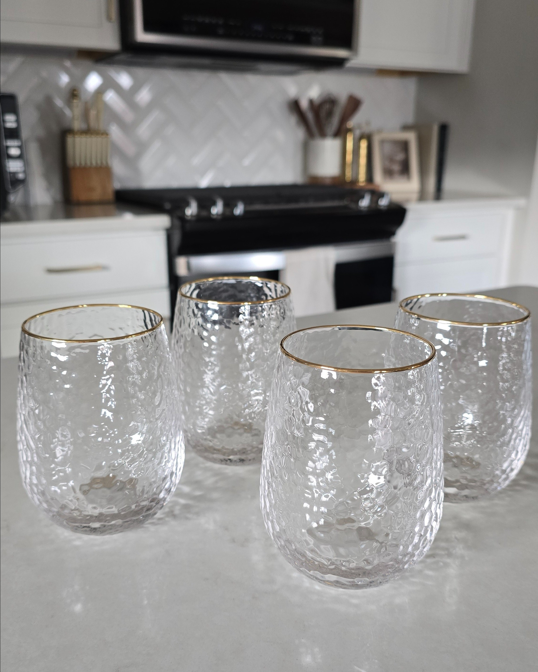 How stunning are these gold-rimmed hammered glass wine goblets from Target? ✨ They look so luxe but are only about $8 each — even the matching drinking glasses. Perfect for everything from cozy nights in to holiday hosting.#TargetStyle #HomeEntertaining

#LTKHoliday #LTKSeasonal #LTKGiftGuide