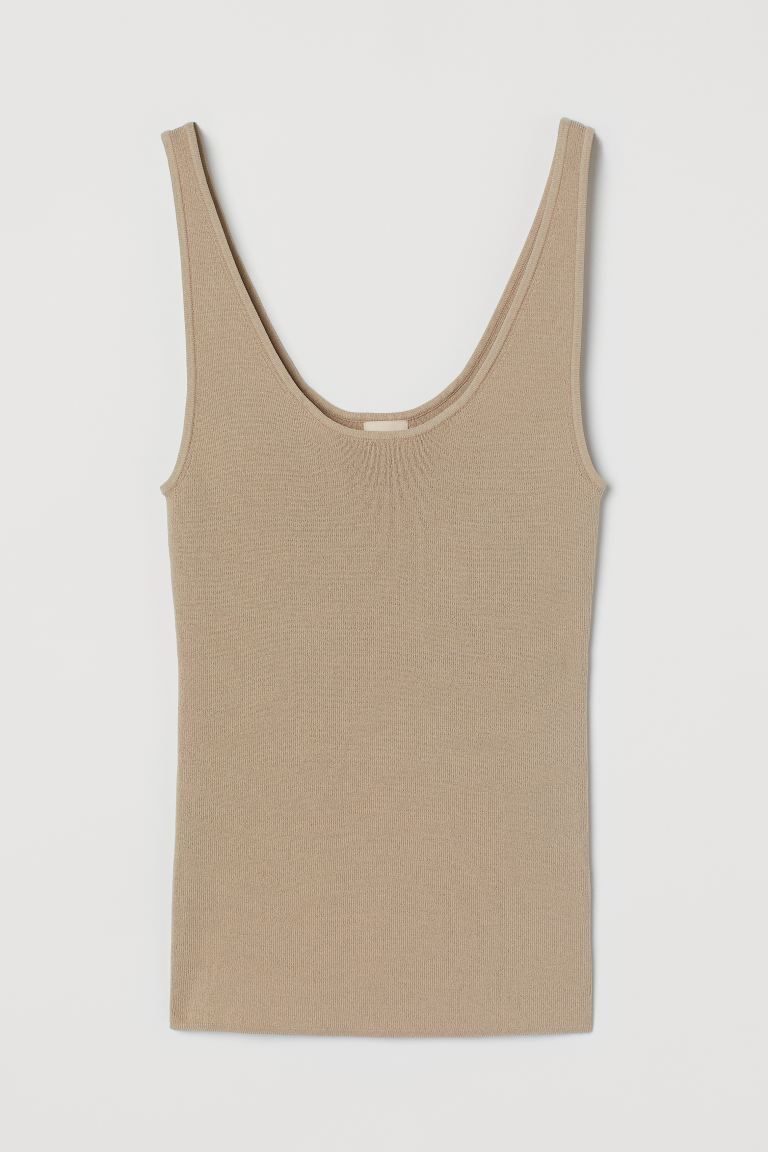 Fitted, low-cut vest top in a knitted viscose blend with deep armholes. | H&M (UK, MY, IN, SG, PH, TW, HK)