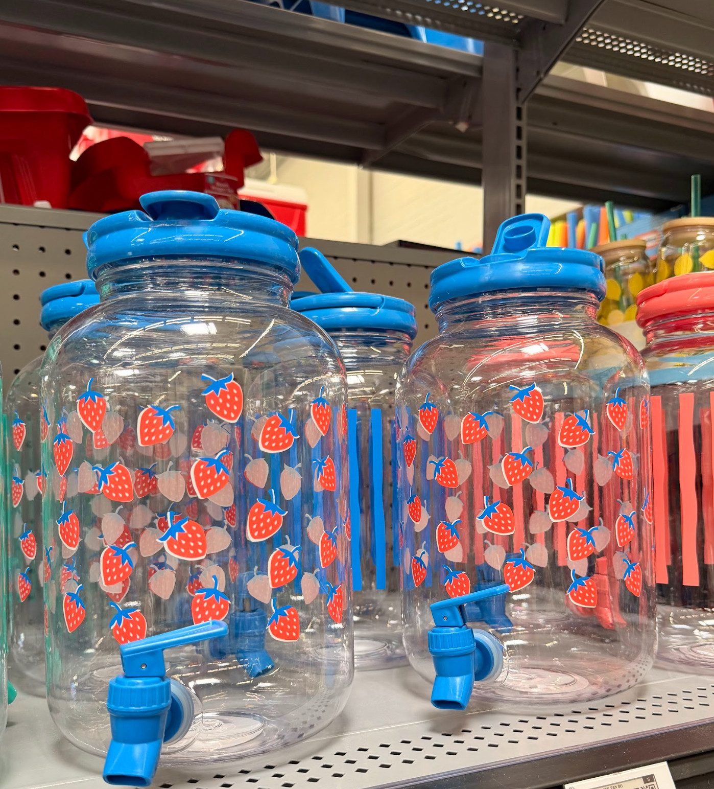The cutest beverage dispensers for only $5!! Get the strawberry print in stores! 

 #LTKSeasonal #LTKHome