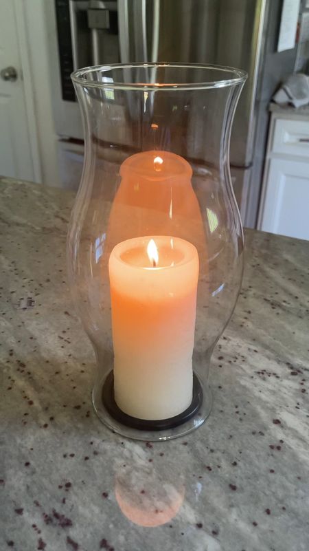 Glass hurricane for candles. Love the cozy glow of these! The hurricane was thrifted but I linked similar ones. Love these candles and the candle tray too! 

#LTKSeasonal #LTKFindsUnder50 #LTKHome