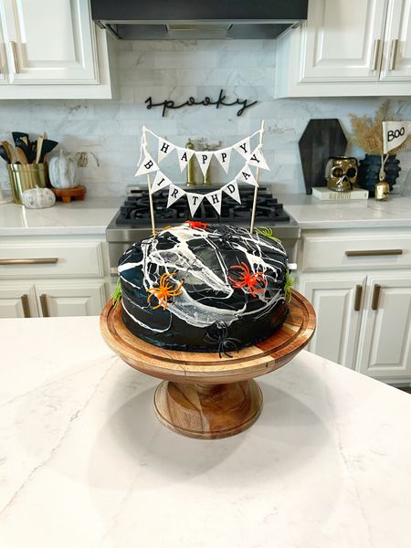 Halloween spiderweb cake but make it for a birthday! This cake is so fun and the orange and white layers are a fun surprise! The marshmallow spiderwebs are my favorite part! Looks amazing and so easy to do. 

#LTKHalloween #LTKHoliday #LTKSeasonal