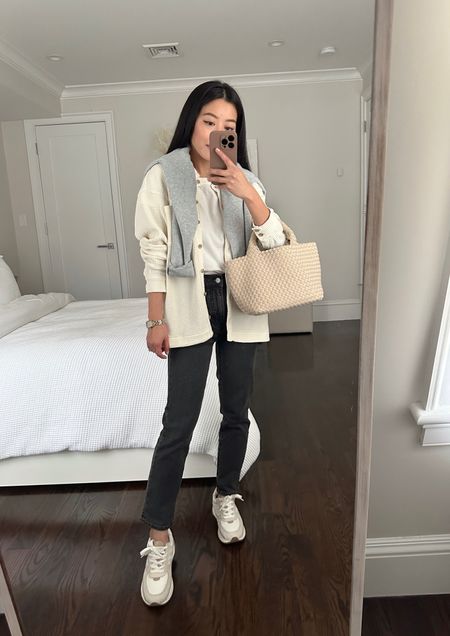 cozy casual winter outfit // Madewell petite jeans + shacket

•Madewell waffle shirt jacket xxs, casually oversized fit on me 
•Perfect vintage jeans sz 23 petite (runs a little big at the waist like most Madewell jeans so I’d size down)
•Cotton crop tee xxs
•Sneakers 5H
•Oversized henley top xxs
•Naghedi bag

#petite casual outfit , travel style