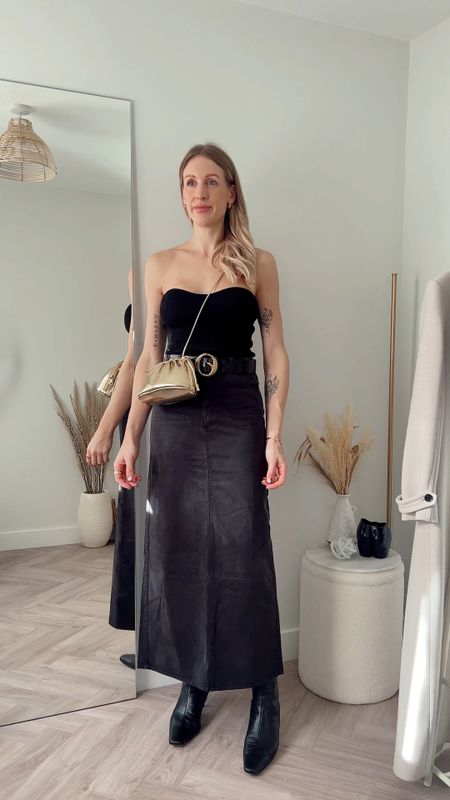 Maxi skirt outfit ideas - 5 ways to wear, breakdown below ⬇️ 

All outfits are styled with a maxi black denim skirt from Weekday:

Look 1
Knit Bandeau - pixie market 
Belt - Clinch belts 
Boots - COS (old/similar linked)
Gold bag - APC via Coggles - *get 15% off + free next day delivery with code - CHARLOTTE15 

Look 2
Jil Sander T-shirt via Farfetch - *code CB10 for 10% off 
Isabel Marant Trainers via Farfetch - *CB10
Cable sweater - (H&M similar linked)

Look 3
Denim jacket - Revolve
Snake handbag - Moda in Pelle 
Tan suede boots - Revolve 

Look 4
Stripe sweater - Toteme
Sunglasses - Prada Symbole
Loewe puzzle handbag 

Look 5
Black silk shirt - lilysilk
Oversize Grey blazer - the Frankie shop 
Trainers - Adidas Samba 

#maxiskirt #denimskirt #waystowear #howtostyle 

#LTKFind #LTKunder50 #LTKstyletip