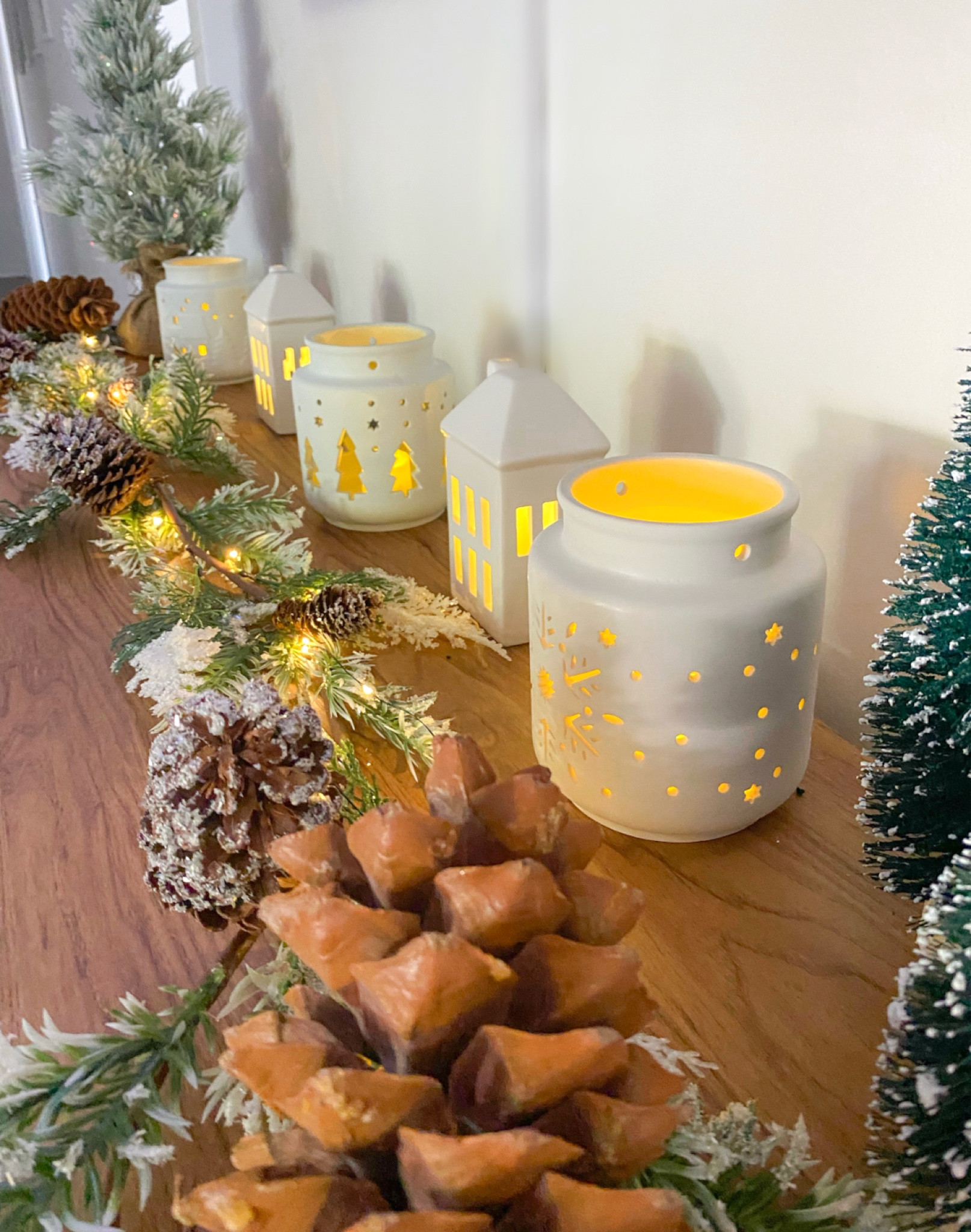 Spray painted these little lanterns and found these adorable ceramic houses at target ! 

#LTKSeasonal #LTKhome #LTKHoliday