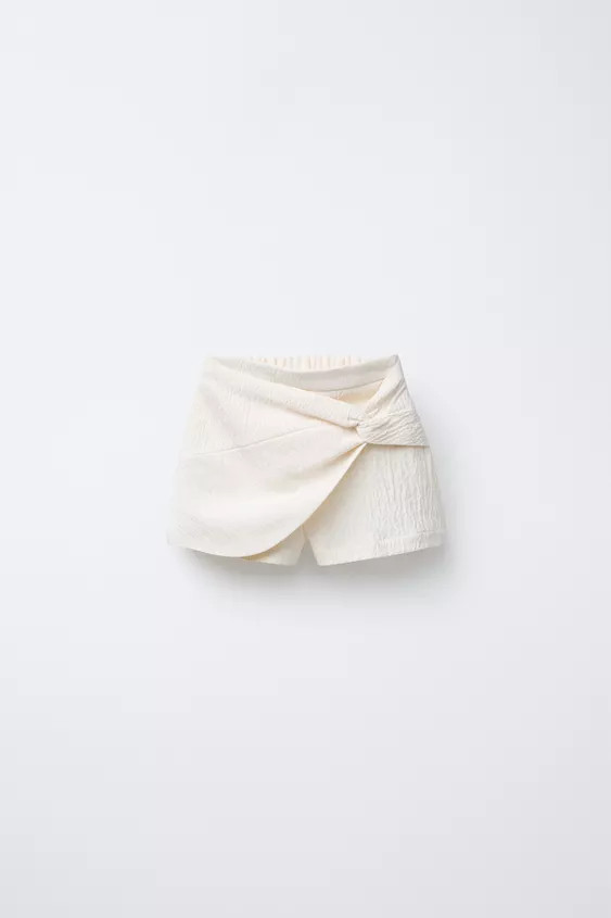 Skort with elastic waistband and wrap closure at front. | Zara US