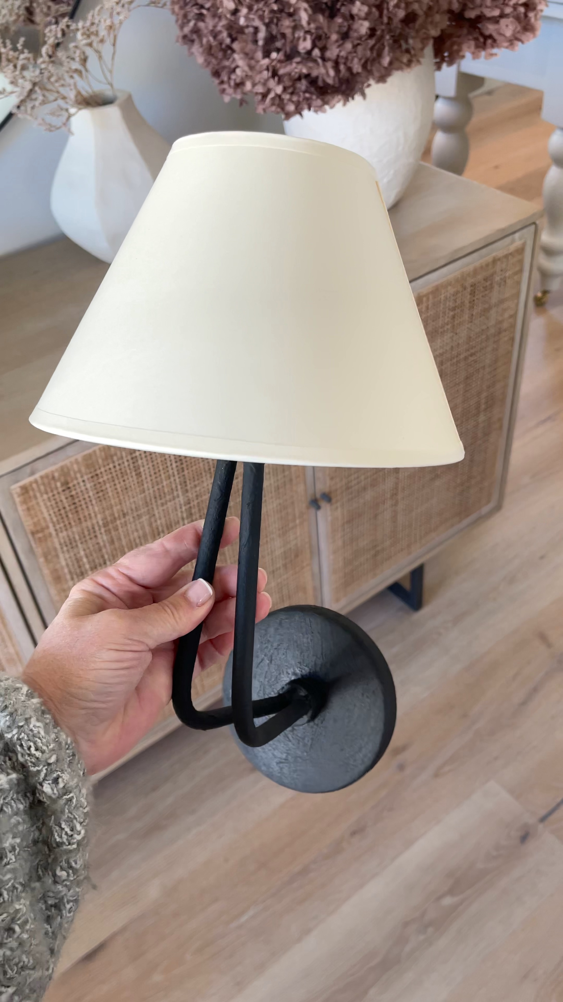 Entryway sconces, black sconce, vintage gold sconce, lighting, cane furniture, white vases, dried florals 

#LTKSeasonal #LTKstyletip #LTKhome