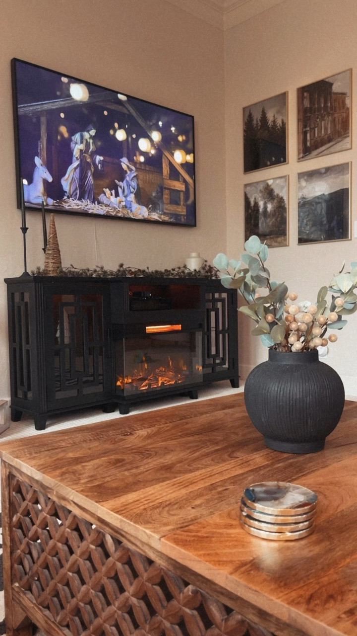 Needing a small “fireplace” to heat up your room? Or maybe you just love the vibe a fire gives off. Especially around the holidays. I did my research on almost every electrical fireplace I could find and SO happy with my choice. It heats up our little living room and makes it the right amount of cozy. 🖤🫶🏼

#LTKfamily #LTKSeasonal #LTKhome