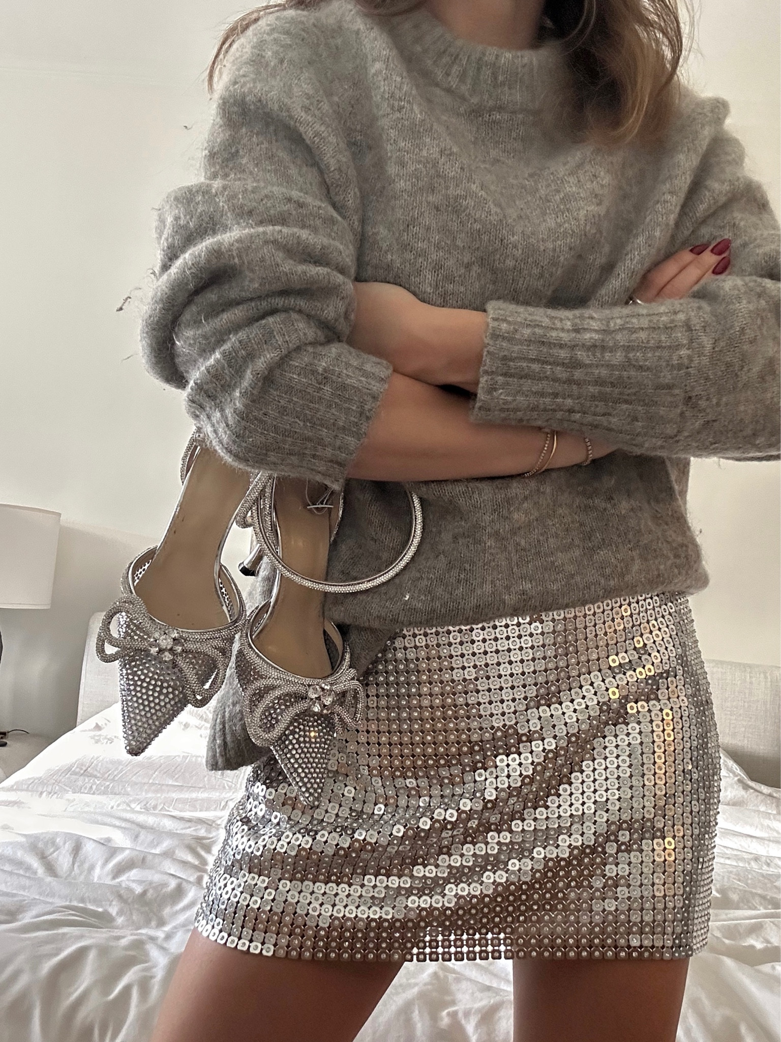 I am wearing a size 4 in the skirt! Runs a smidge big. Sweater is not recent but included a similar one! 