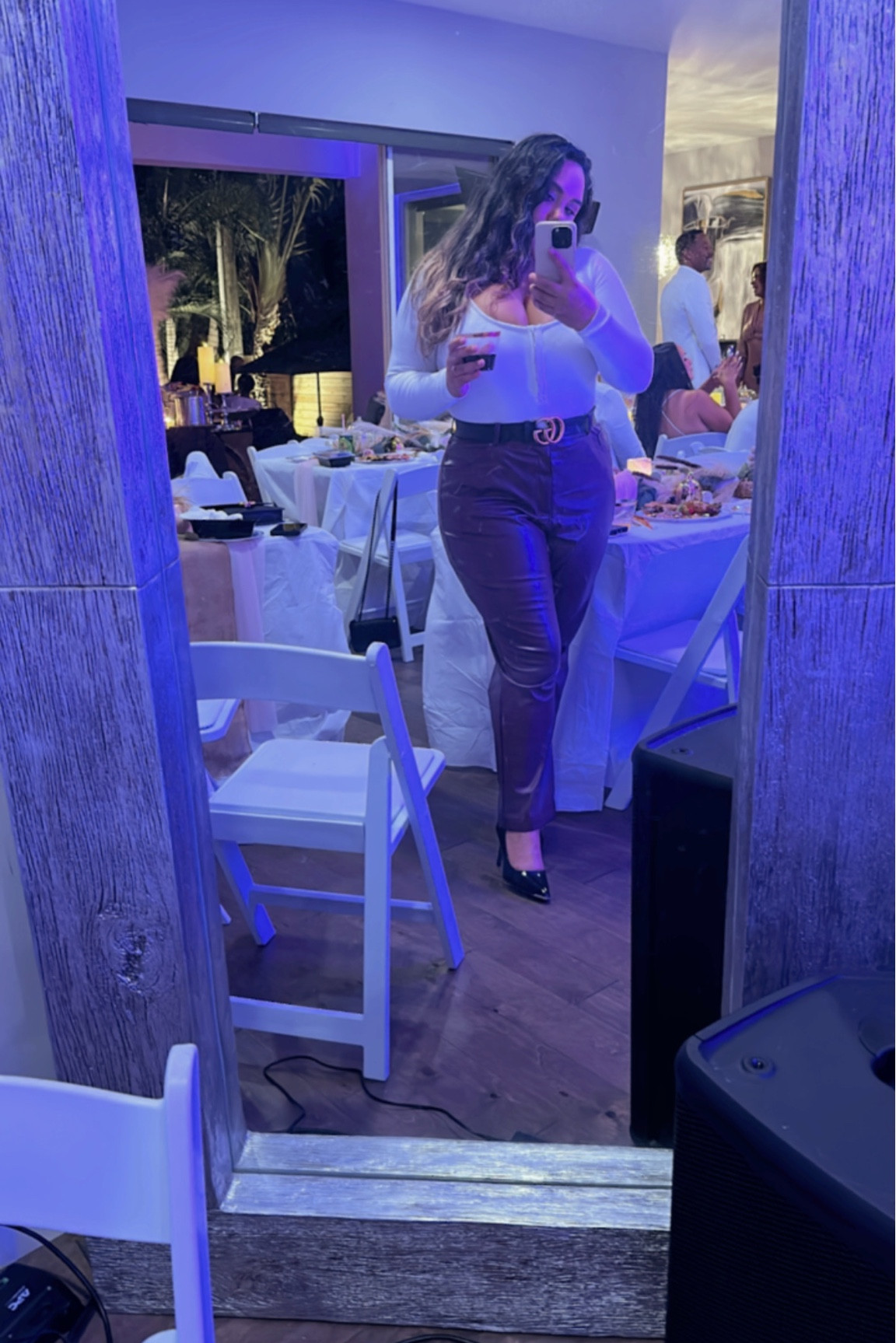 Feeling Festive at a Friendsgiving party wearing a white long sleeve body suit with burgundy faux leather pants and black closed toe heels. Accessories: black belt and gold hoop earrings. 

#LTKGiftGuide #LTKCyberWeek #LTKHoliday