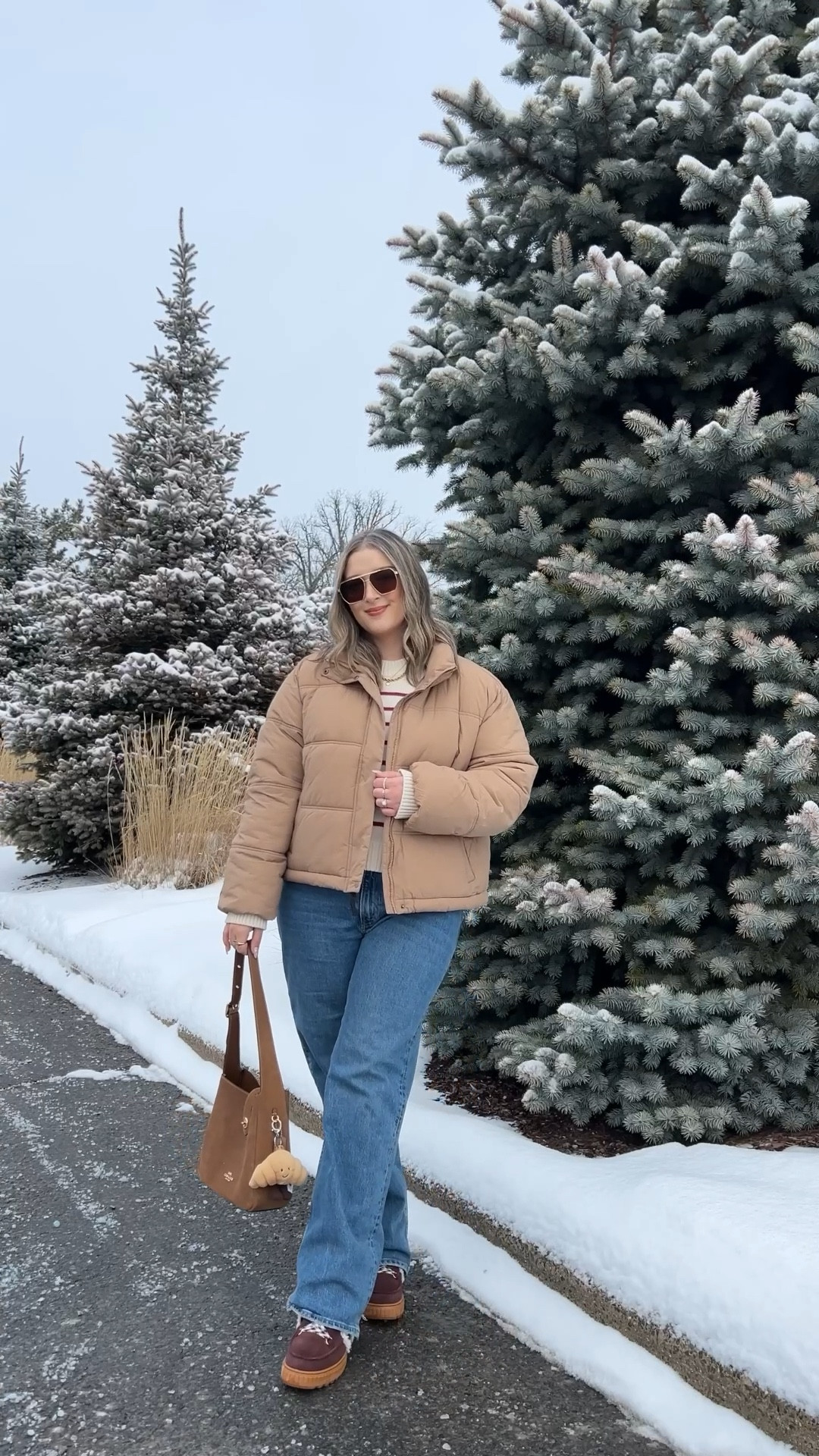 Winter ootd! Wearing my usual size L in the tan puffer jacket and striped sweater. These Abercrombie jeans are my all time fave! Wearing 32 for a looser fit. My Sorel snow boots are waterproof and so cozy, consider sizing up if you plan to wear thick socks. Canadian puffer jacket link under “similar products"

#LTKwinter #LTKmidsize #LTKjeans