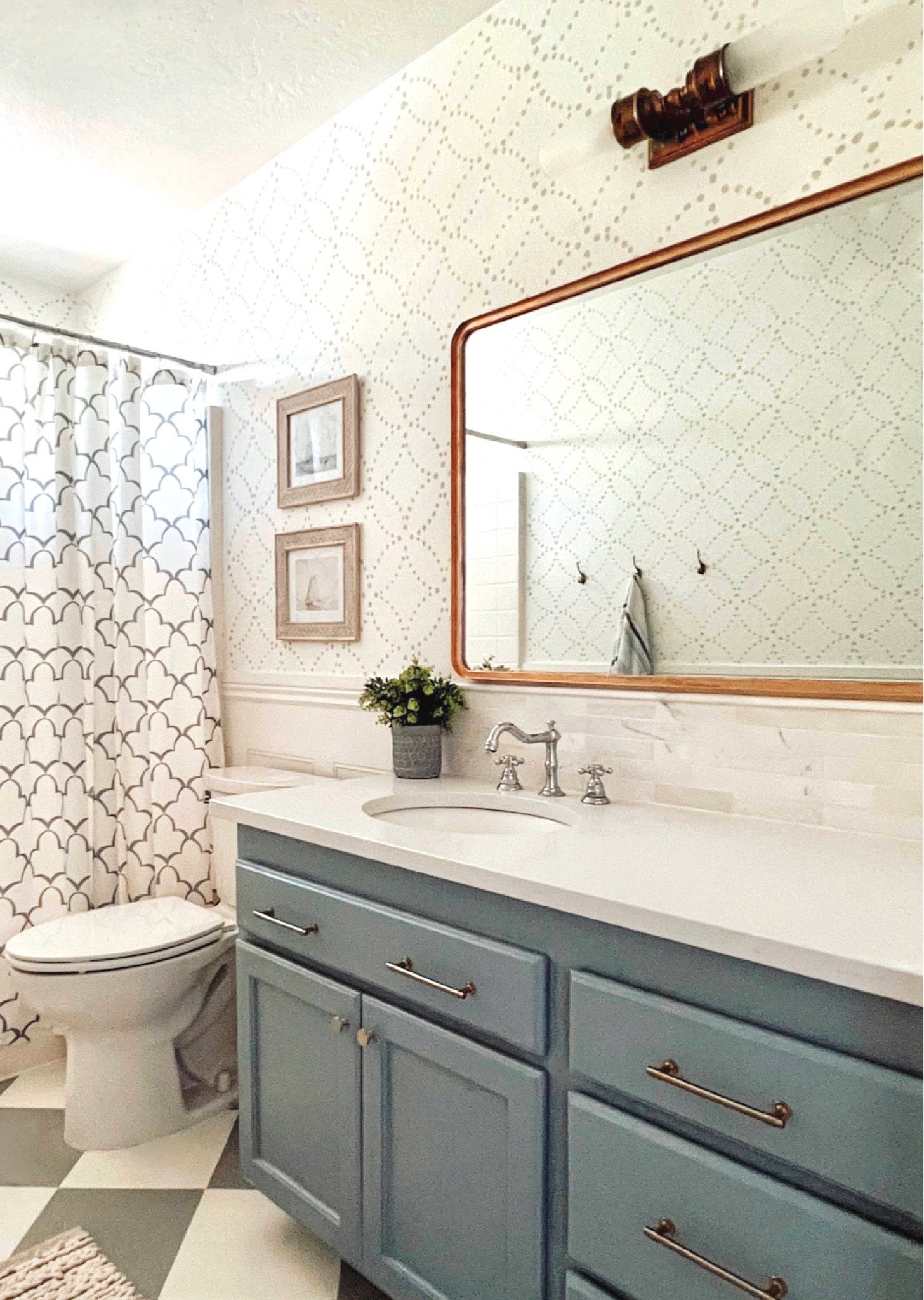 Colorful vintage-inspired bathroom // chrome heritage faucet // antique brass sconce // brass cabinet pulls 

#LTKhome