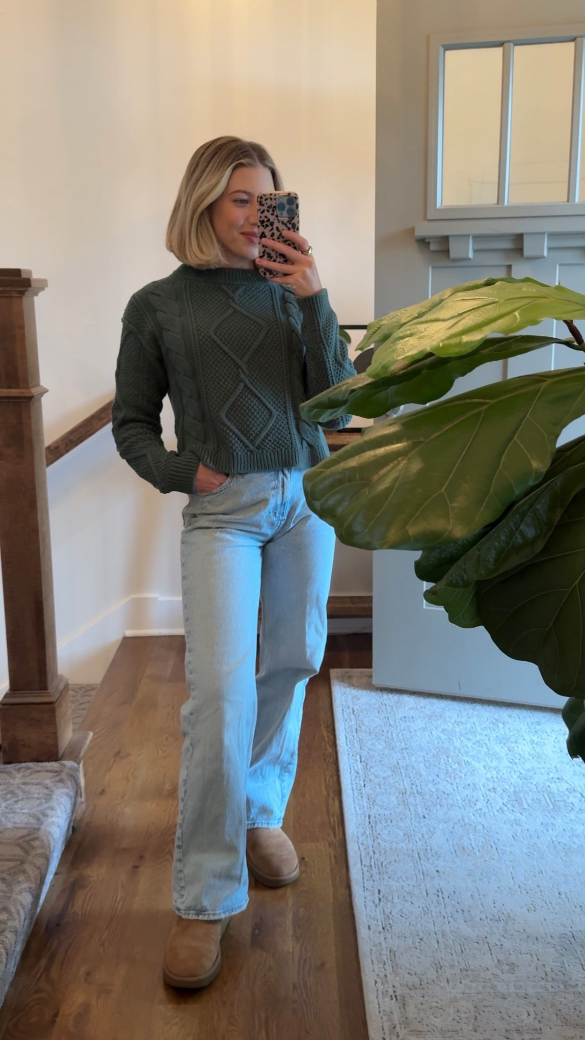 Peak cozy season outfit: a chunky cable knit, crisp white shirt layered underneath, jeans, and my go-to UGGs. Easy, classic, and mom-life approved 🍂 #LTKFallFashion #LTKOutfitInspo