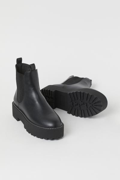 Chelsea boots in faux leather with platform soles. Elasticized side panels and a loop front and b... | H&M (US + CA)