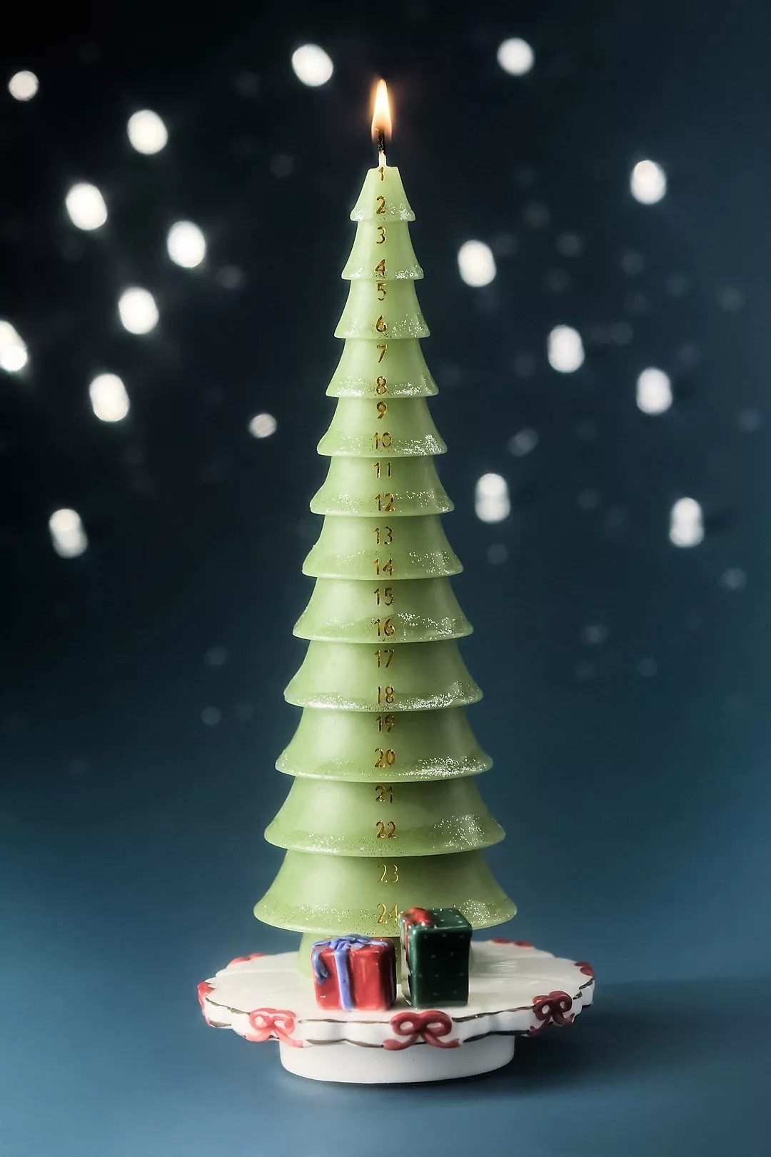 Christmas Tree Advent Calendar Set

Crafted from unscented paraffin wax and paired with a ceramic base, this evergreen-shaped candle features 24 numbered segments. Burn a segment each December evening as you count down to Christmas

#LTKSeasonal #LTKHome #LTKmomlife