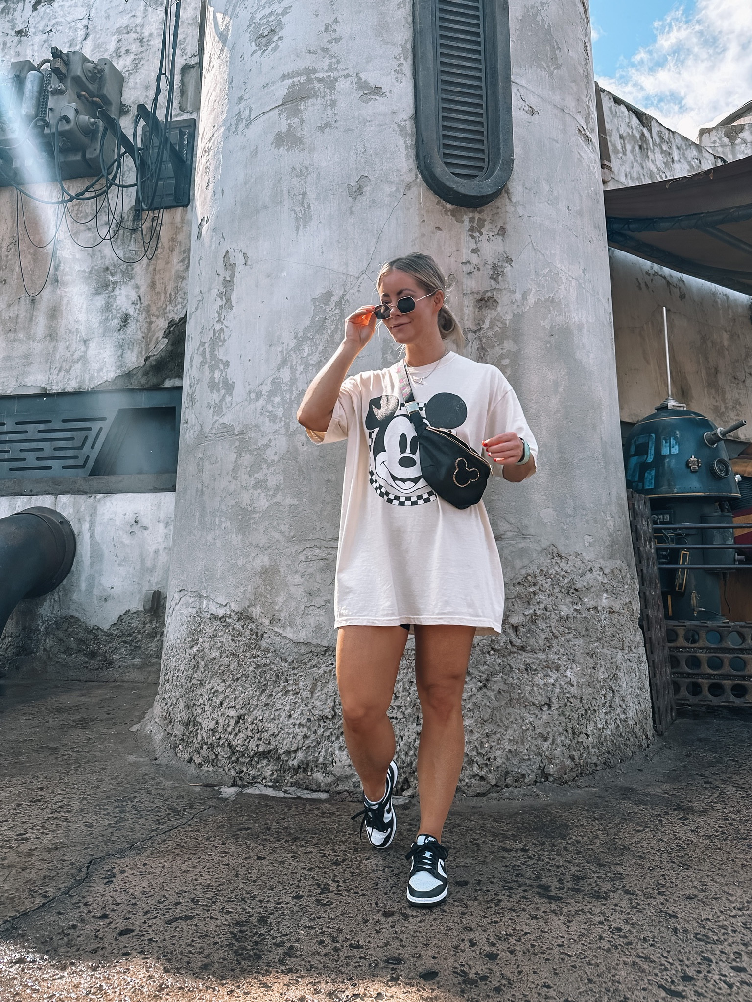White oversized Mickey Mouse graphic t-shirt, black belt bag, Nike sneakers, Disney World outfit inspiration, resort look

#LTKfamily #LTKSeasonal #LTKtravel