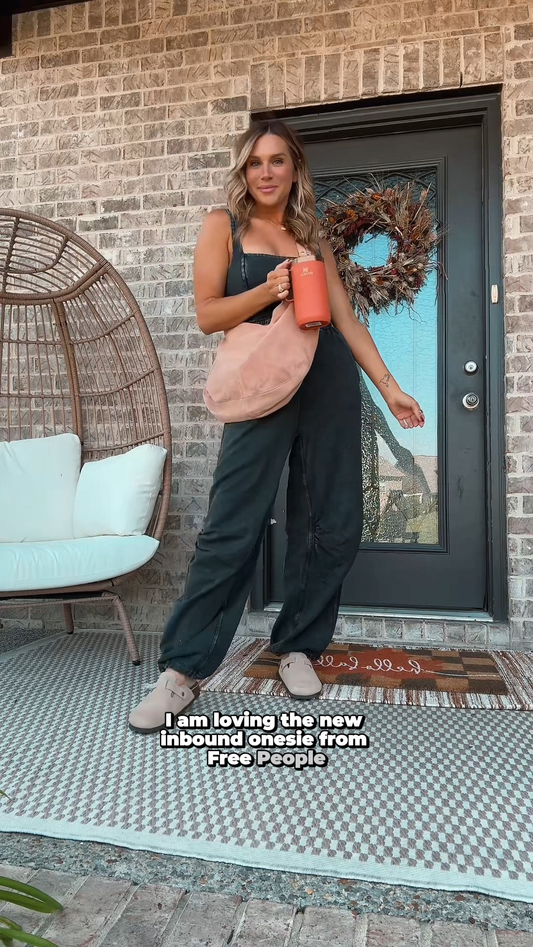 Loving this onesie from Free People for an early Fall look! It’s so soft, has a stretchy waistband, adjustable tie, and adjustable style joggers. I’m wearing a size medium and it fits me perfect! Paired it with my favorite Amazon clogs, a cute light pink suede satchel bag also from Free People and my favorite Stanley cup! #freepeople #amazonfinds #amazon 

#LTKSeasonal #LTKStyleTip #LTKShoeCrush