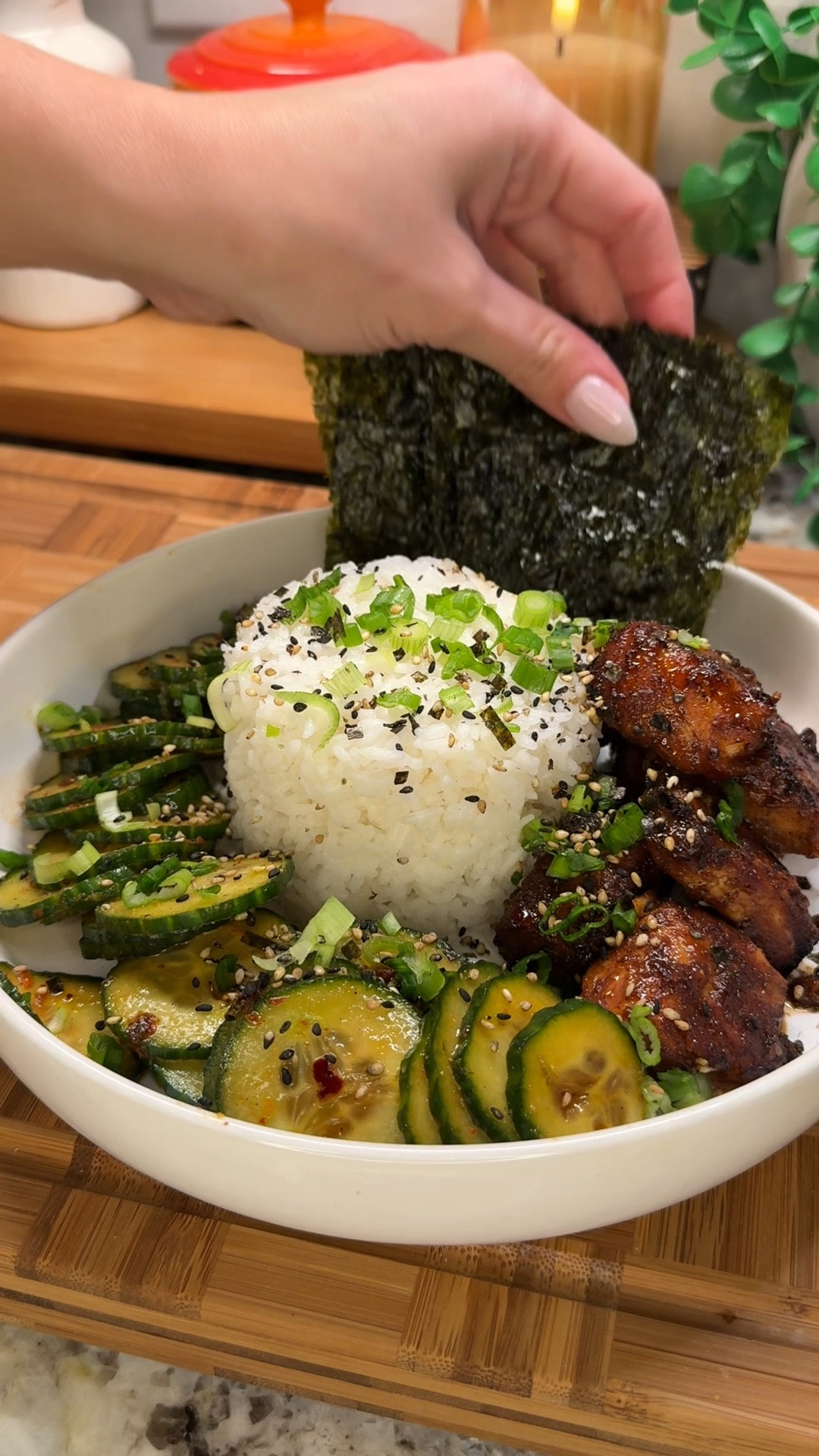these honey garlic salmon bowls are a weeknight dinner staple in our house! insanely flavorful salmon bites with a sweet & spicy cucumber salad- healthy, fresh and so easy to make🍚🥒

I love using dried seaweed snacks to wrap everything up into the perfect bite! drizzle on some siracha mayo for an extra punch🌶️

Ingredients:
- skinless salmon filet, cut into cubes
- 1/3 cup soy sauce
- 1/4 cup honey
- 2 tsp sesame oil
- 4-5 cloves garlic, minced
- 1 tsp salt, 1 tsp pepper, 2 tsp onion powder
*let marinate for at least 10 minutes. air fry at 400°F for about 8-10 minutes, flipping and adding extra sauce halfway through.

cucumber salad
- 2 large cucumbers, sliced thinly and dried
- 1/4 cup soy sauce
- 2 tbsp rice vinegar
- 2 tsp sesame oil
- 1 tbsp honey
- 2 tbsp chili garlic crunch
- 1 tsp salt, 1 tsp pepper, 2 tsp garlic powder, 2 tsp onion powder

rice
- 1 cup jasmine rice
- 2 cups water
- 1 tbsp rice vinegar
- 1-2 tsp white sugar
- 1/2 tsp salt

top with
- green onion
- furikake flakes
- dried seaweed snacks
- optional: siracha mayo

#LTKHome #LTKSeasonal #LTKFamily