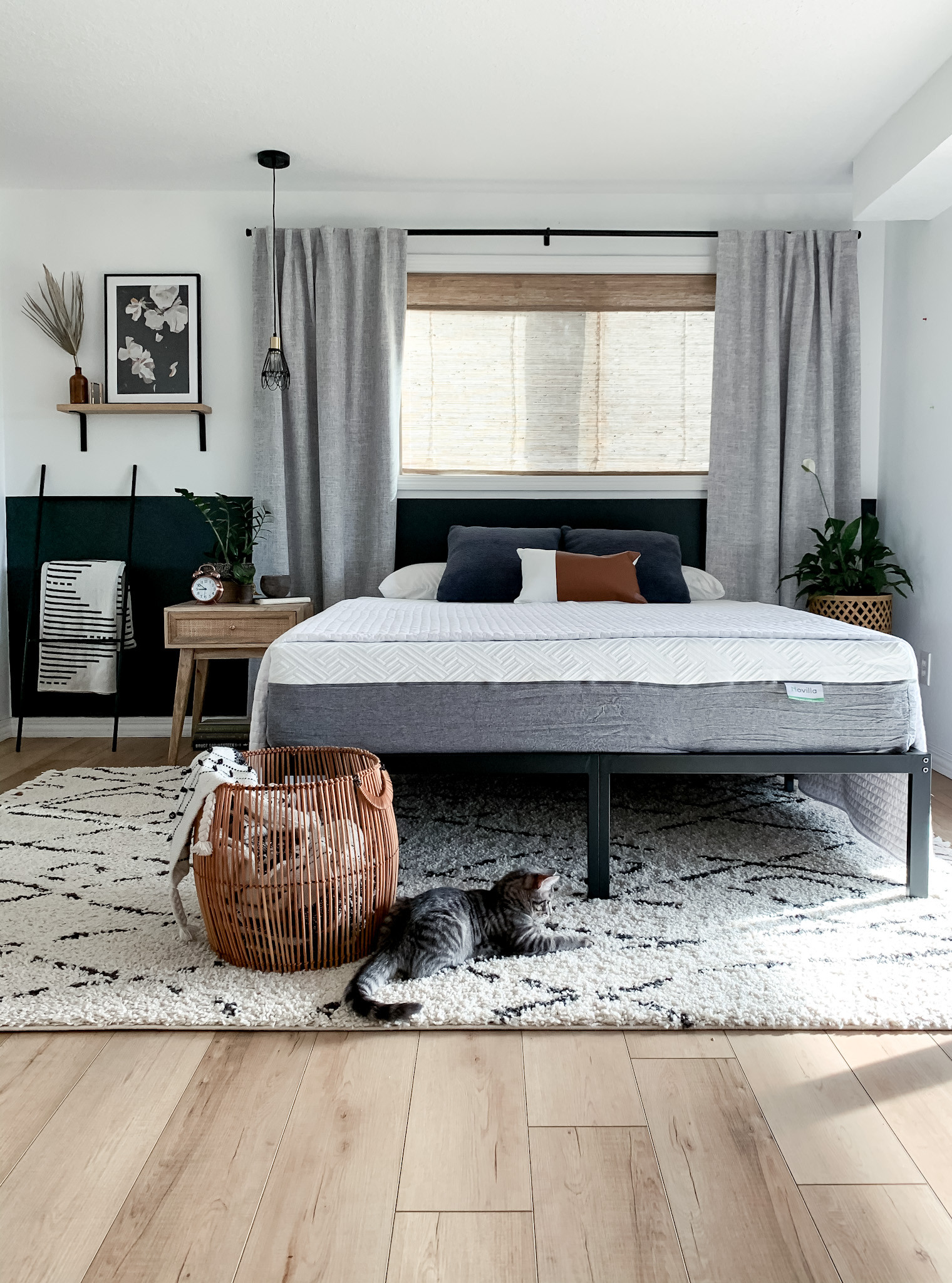 The bedroom furniture and decor foundation here make all the difference: the woven wood shades, linen curtains, black accent wall, shaggy rug quality mattress all goes a long way for a perfect canvas in this neutral bedroom

#LTKHome