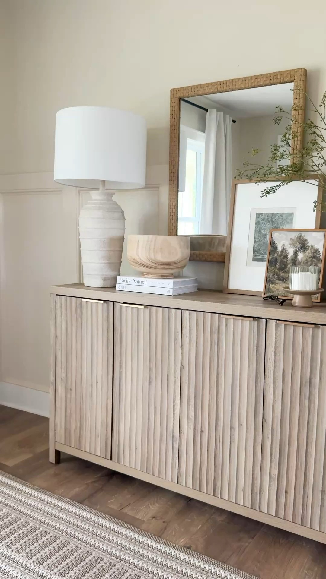 Sideboard styling,
Fluted sideboard, table decor, home decor, neutral decor, sideboard, table lamp, faux greenery, vase

#LTKHome #LTKSaleAlert
