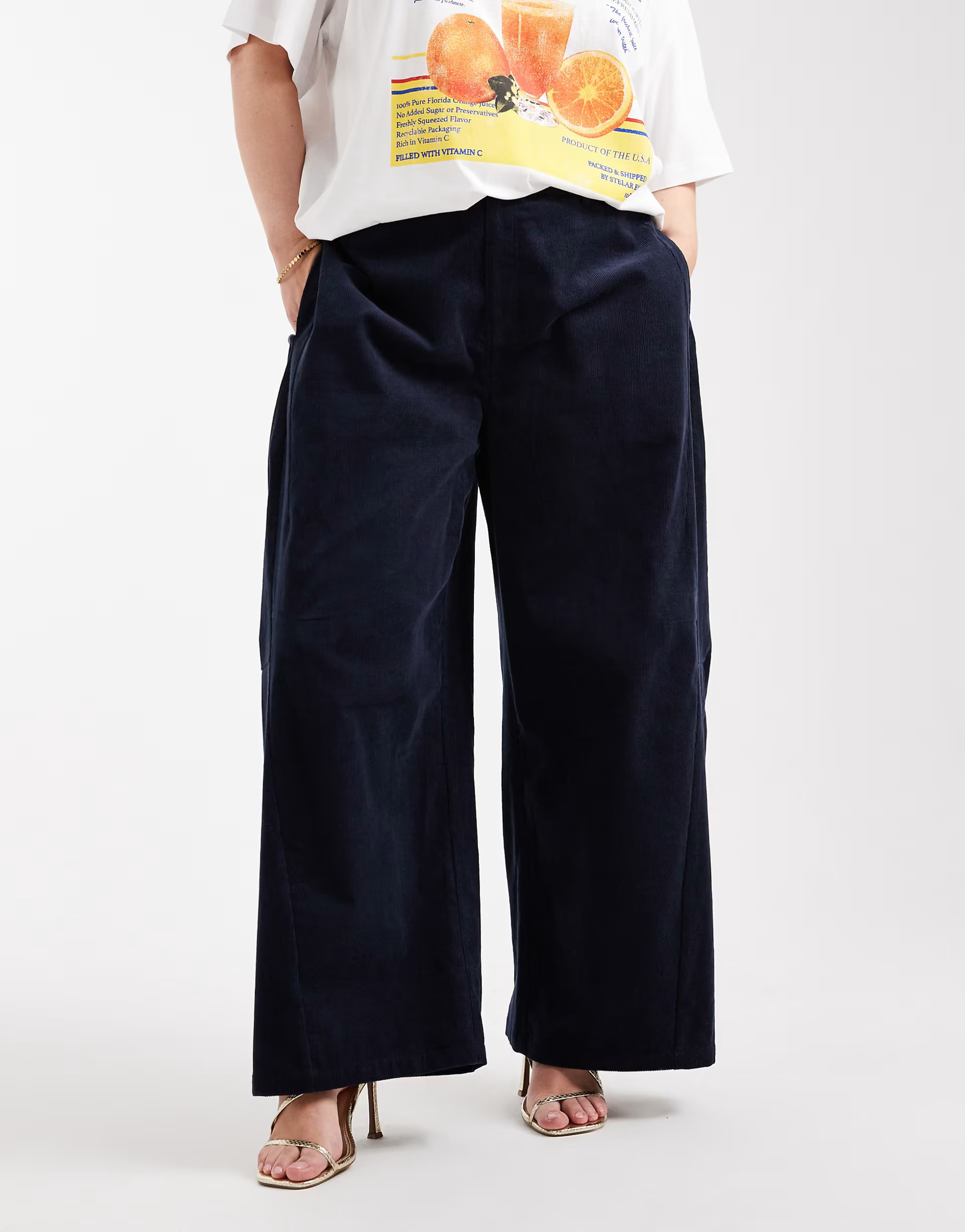 ASOS DESIGN Curve baby cord extreme horseshoe trousers with seam detail in navy | ASOS (Global)