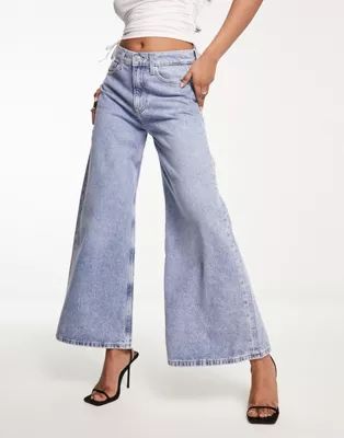 Calvin Klein Jeans low rise wide leg slouchy jeans in mid wash | ASOS (Global)