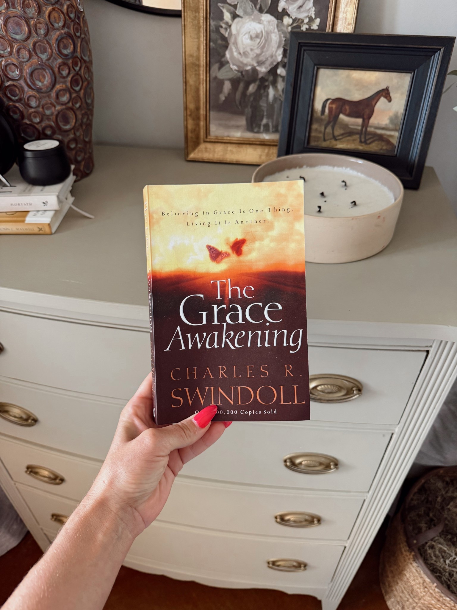 The book I’ve been reading on quiet Sunday afternoons. Maybe a quarter of the way through, but it has brought me to tears every time I’ve picked it up.
#devotionals #savedbygrace 

#LTKstorytime #LTKHome #LTKselfcare