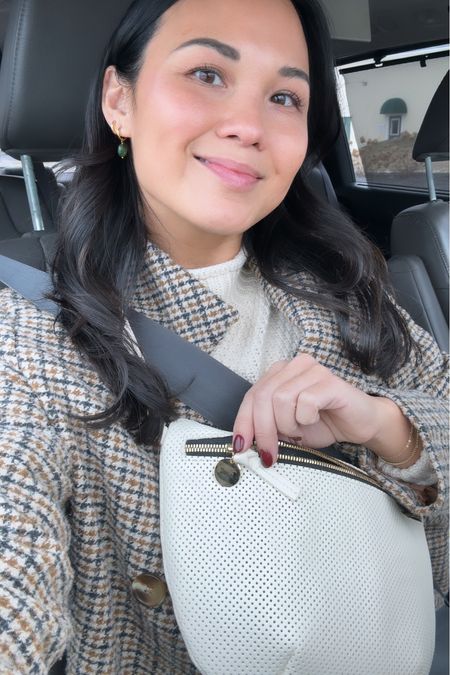 Been wearing this everyday bag for months, had to get it in another color and loving the white! Earrings, sweater, clogs. Winter outfits, everyday style, fanny pack, sling bag. 

#LTKitbag #LTKSeasonal #LTKstyletip