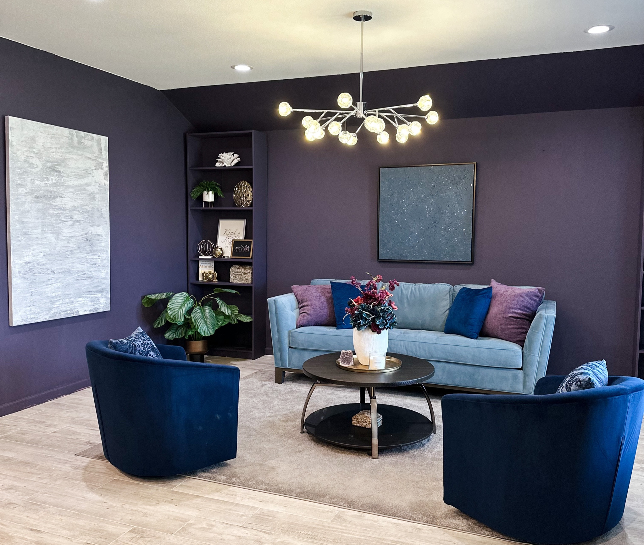 Beautiful Bold living room! Luxurious velvet sofa paired with navy swivel chairs.   Bookcase to display an array of accessories that reflect your personal style. Elegant navy velvet drapes create a stunning backdrop. Be inspired to create your own Bold and Beautiful living room.  

#LTKhome #LTKFind