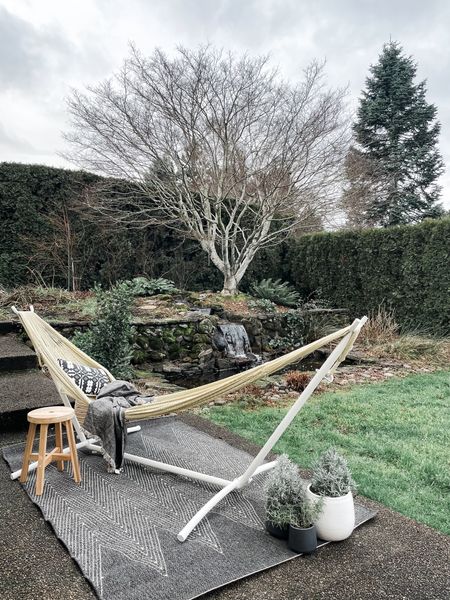 Who says paradise can’t come to you? We may be in the throes of winter here in Oregon, but I created a mini getaway in my new backyard with the help of @yellowleafhammocks. #ad

Using their Signature Woven Hammocks (Big Sur) + Stand, this blank little patio turned into an instant escape. I added a few other items on hand to make it feel more cozy & functional:
- Aromatic plants for the senses (rosemary + lavender)
- Outdoor rug to set the scene
- Pillows & blankets for a little snooze
I’ve tagged my hammock along with a few other Yellow Leaf favorites, to help you create your own backyard oasis!


#LTKhome