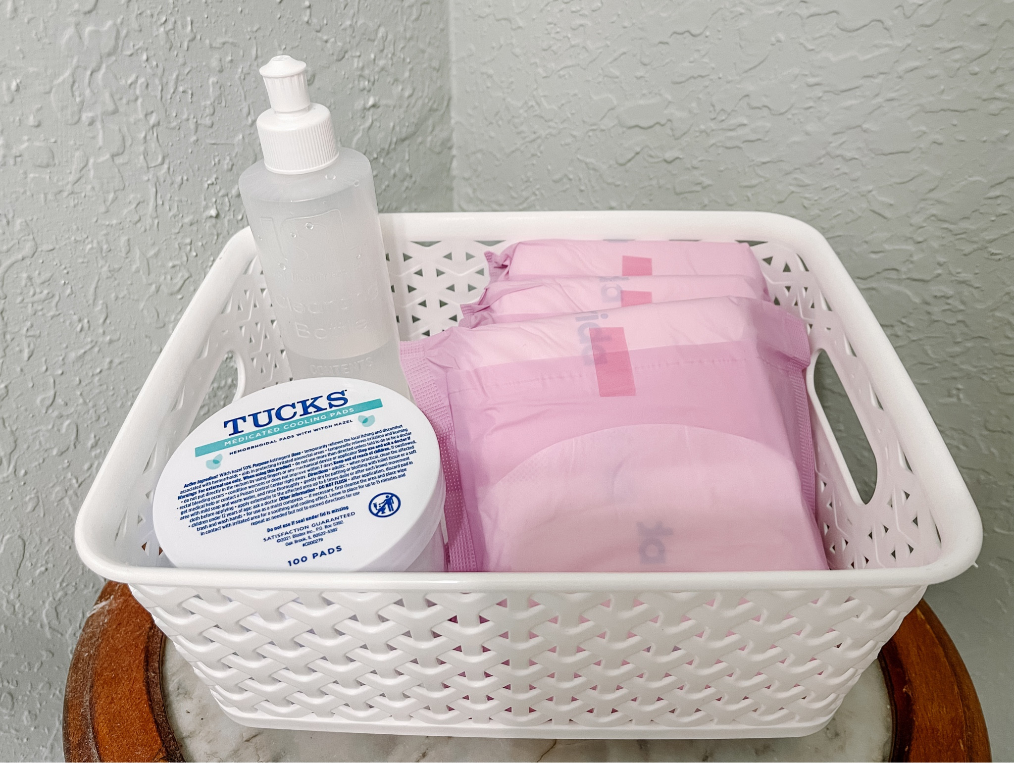 I placed my post partum essentials after giving birth into a basket in my upstairs and downstairs bathroom. This allowed me to have everything stocked and ready to use so I didn’t have to constantly go up and down the stairs during recovery. 

This time around, I enjoyed using the Frida post partum pads and disposable underwear. I was fine using the hospital provided peri bottle and also used Ticks witch hazel pads  

#LTKbaby #LTKbump