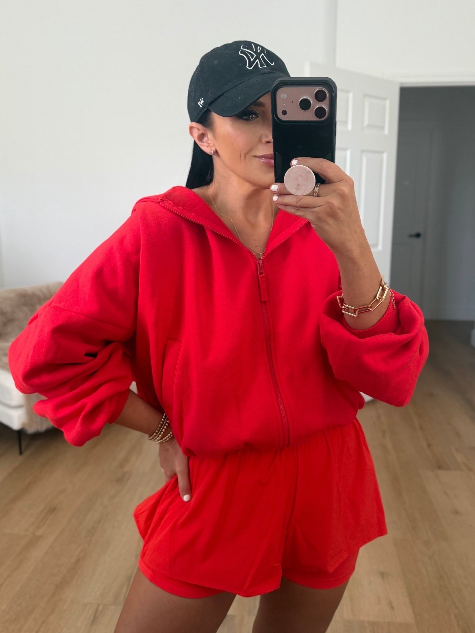 Blogilates Women's Marshmallow Full Zip Hooded Sweatshirt wearing size medium. Blogilates Women's Woven Ruffle Shorts wearing size medium. 


