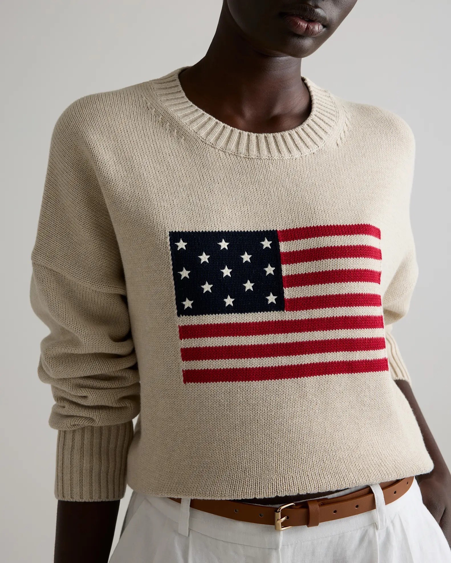 The only question is which color!? Both are so chic. 
Flag sweater. Get it now before they sell out  