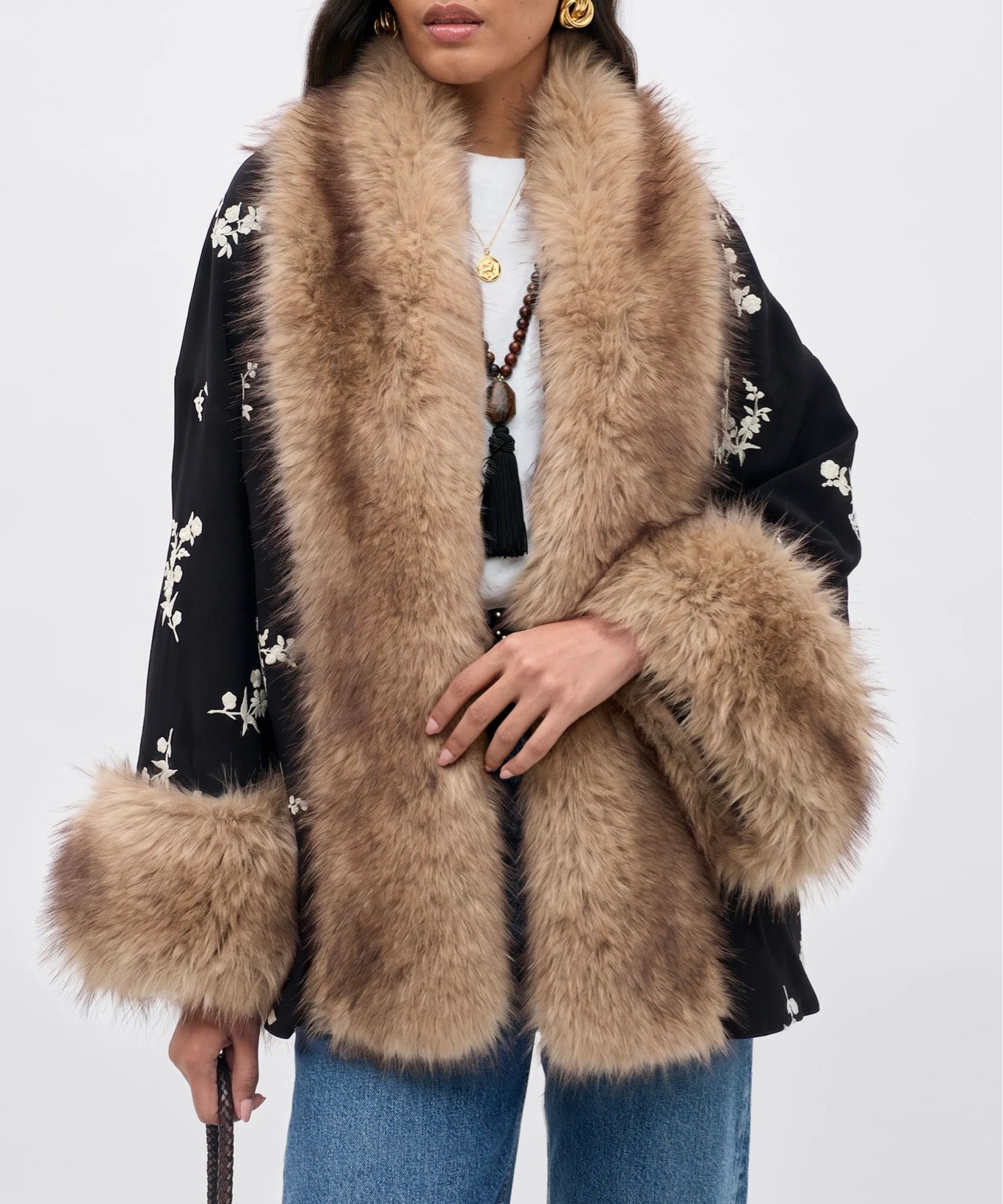 The Micah Jacket. Silhouette inspired by traditional Kimono shapes. White floral embroidery throughout. Faux fur trim on the lapels and cuffs. Wear it over jeans and a white tee. Wear it over a gown for a black-tie invite. The jacket you'll reach for more than you planned.

#LTKNYFW #LTKootd #LTKTravel