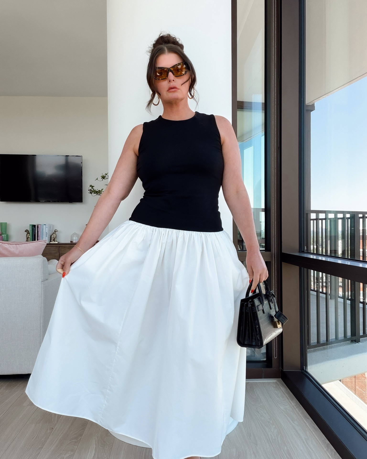 We love a mixed media color blocking moment. This black & white midi dress is perfect for summer.

@Express #dresstoexpress #expresspartner